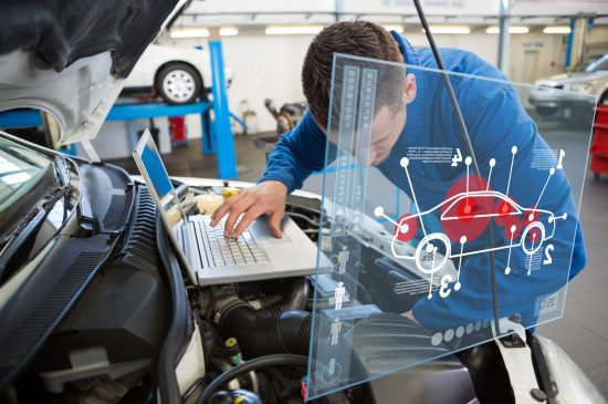 Car interface against mechanic using laptop on car